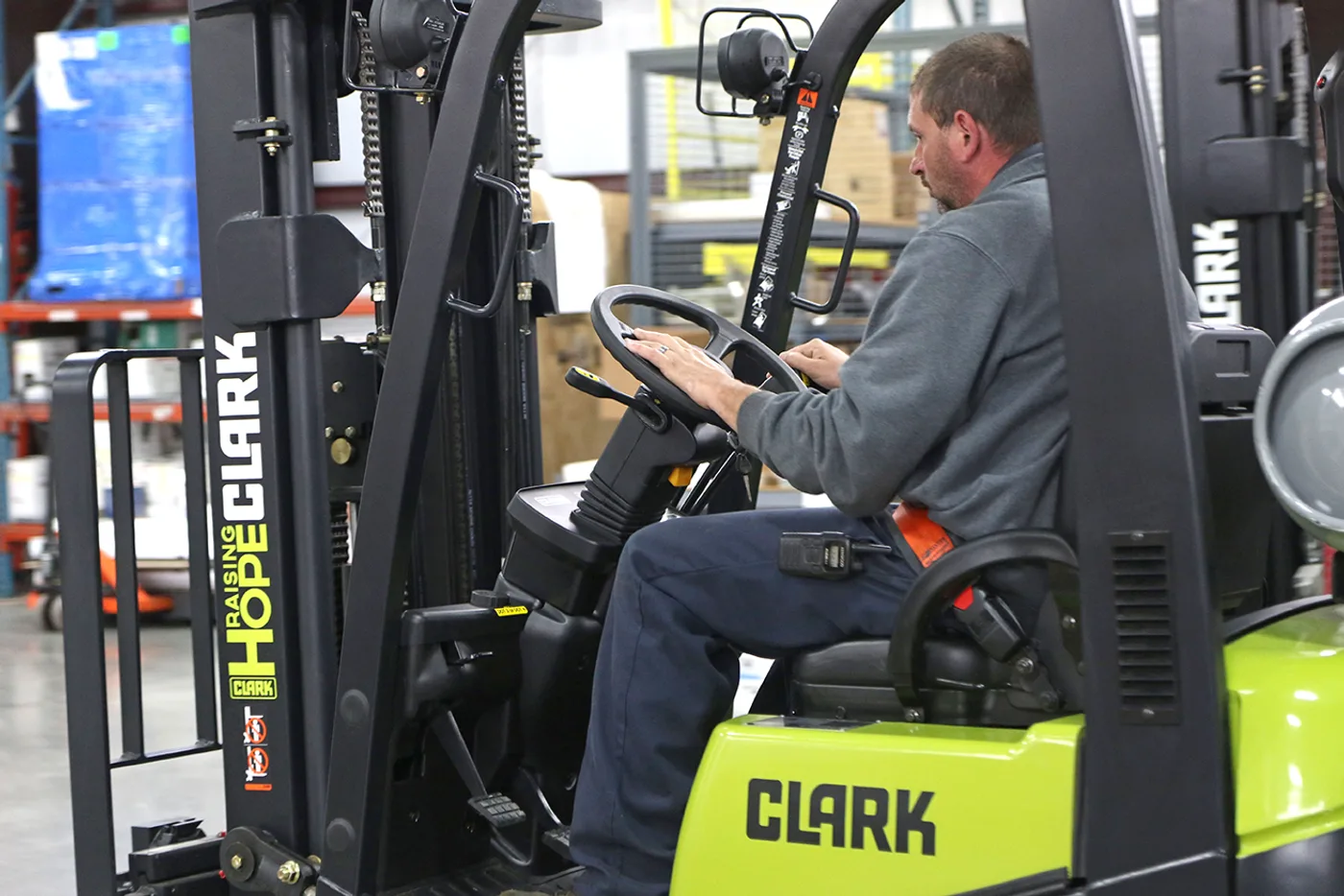 Operator at the controls of a Clark C15C forklift in a Delaware warehouse