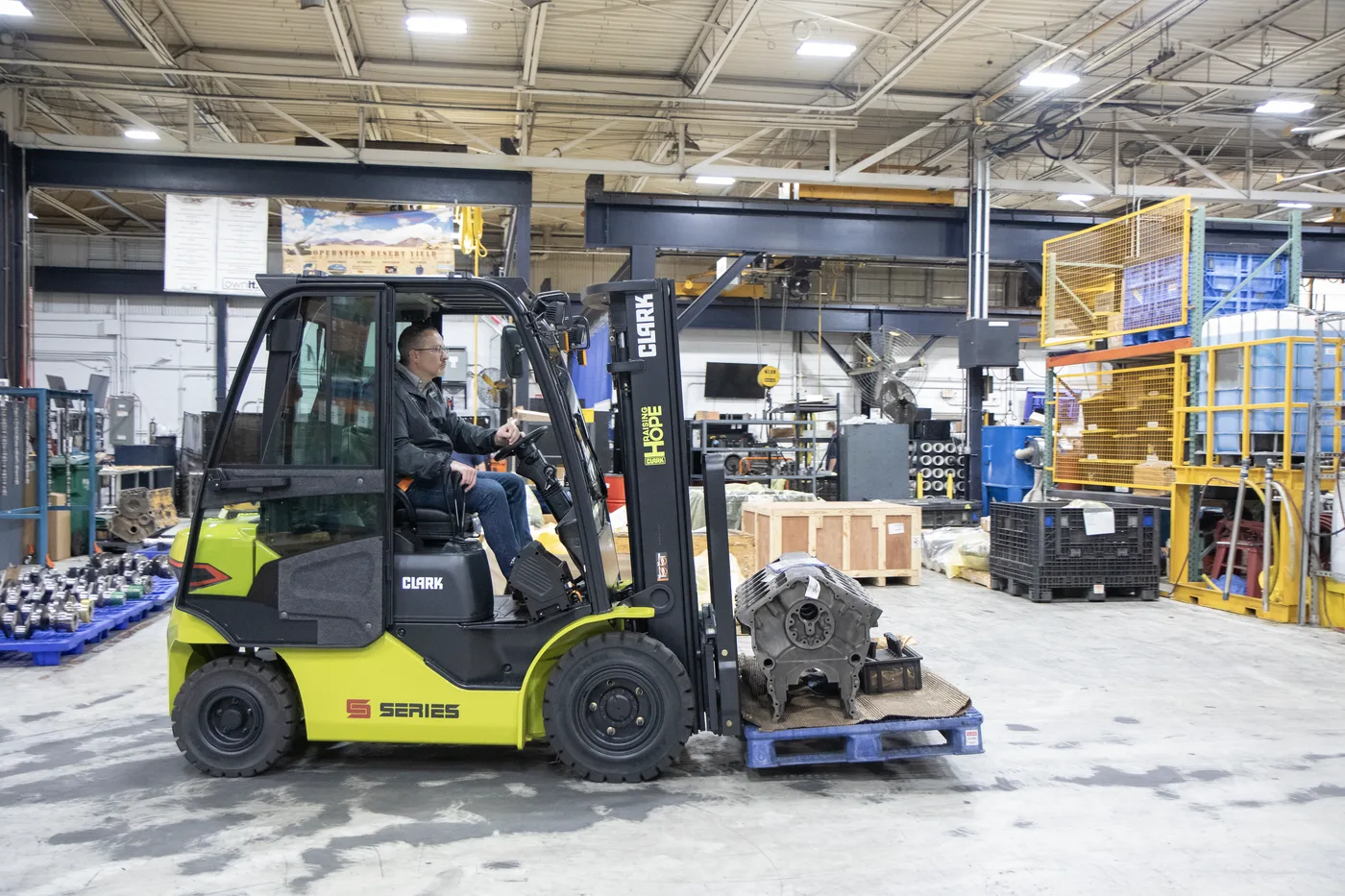 Clark S-Series forklift moving a machined casting in a Delaware manufacturing plant